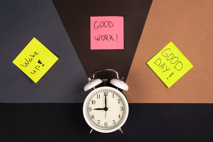 Alarm clock and stickers with motivational inscriptions