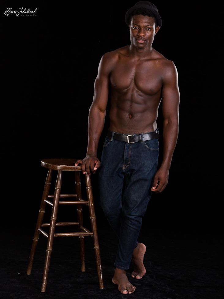 Marius with jeans and black background