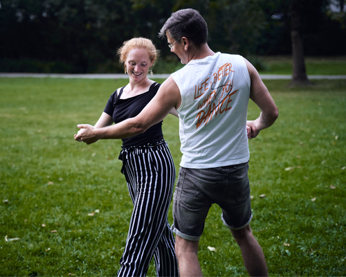 Couple dancing in a park