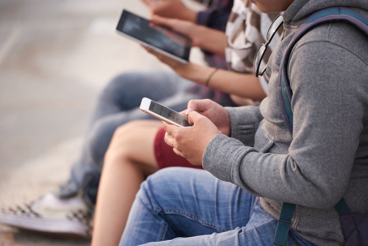 Teens using smartphones